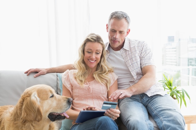 Couple with credit card shopping online