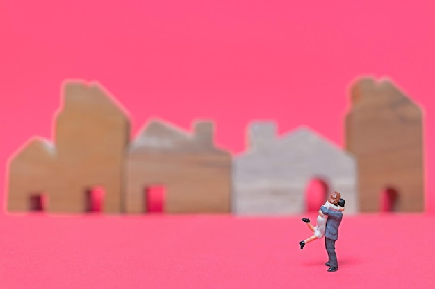 Photo couple with house on pink background