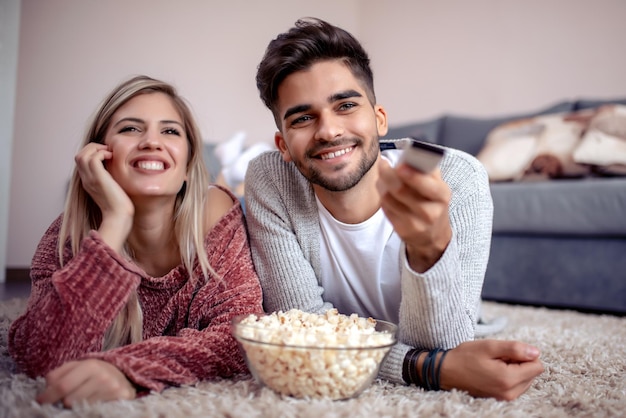 Couple with popcorn watching a movie