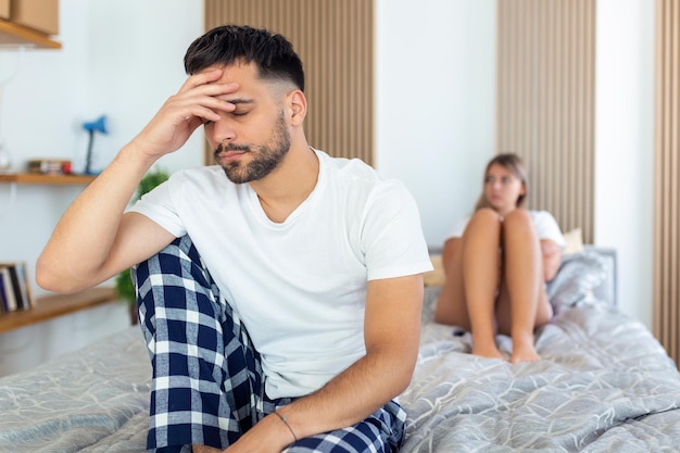 Couple With Problems Having Disagreement In Bed Frustrated couple arguing and having marriage problems Young couple into an argument on bed in bedroom