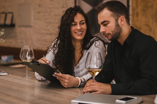 Couple working together at cafe