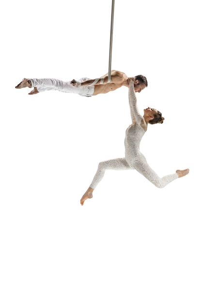 Couple of young acrobats circus athletes isolated on white