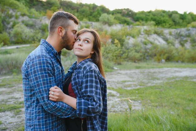 Couple of Young Happy Travelers Hiking