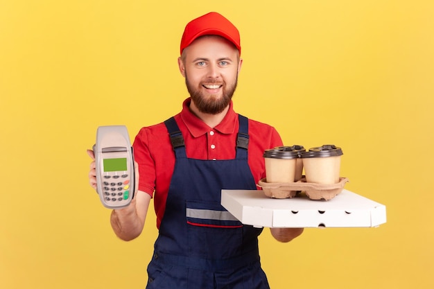 Courier holding coffee and pizza box delivering drinks and food showing pos payment terminal