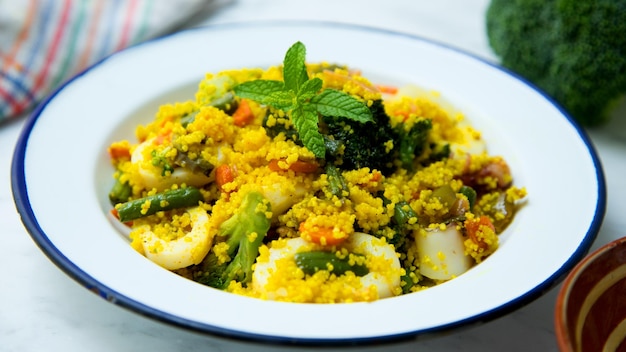 Couscous salad with assorted vegetables and calamari