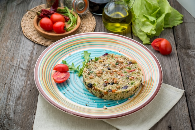 Couscous with shrimps and vegetables in a bowl