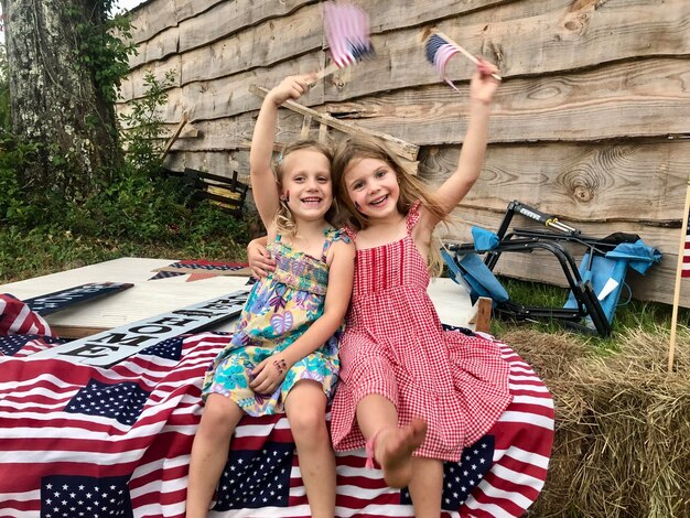 Photo cousins having fun on the fourth of july