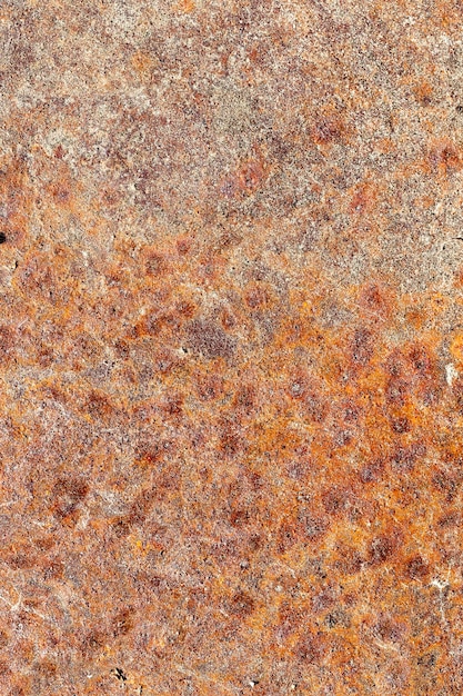 Covered with multicolored rust stains metal sheet of old design