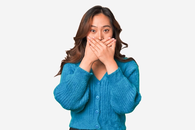 Covering mouth with hands looking worried