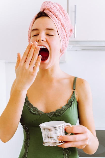 Covering yawn with hand in early morning