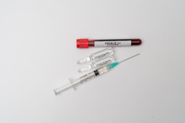 COVID 19 Coronavirus, infected blood sample in the sample tube, Vaccine and syringe injection It use for prevention, immunization and treatment from COVID-19