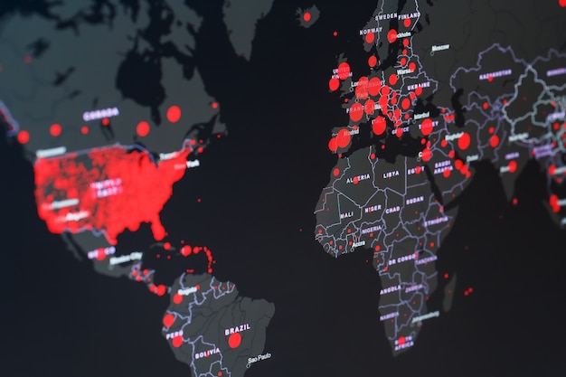 COVID-19 coronavirus pandemic on the global map with red dots of infection centers.