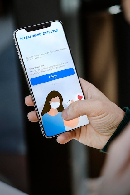 COVID-19 tracking app showing no exposure detected text on the phone