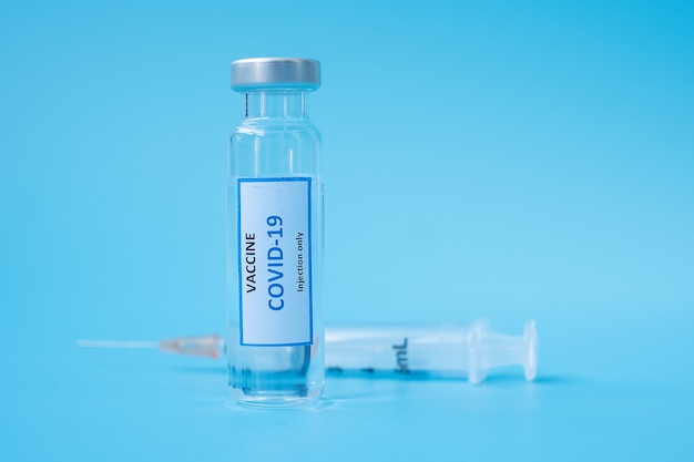 COVID-19 Vaccine vial and injection Needle Syringe against Coronavirus infection in hospital laboratory. Medical, health, Vaccination and immunization concept