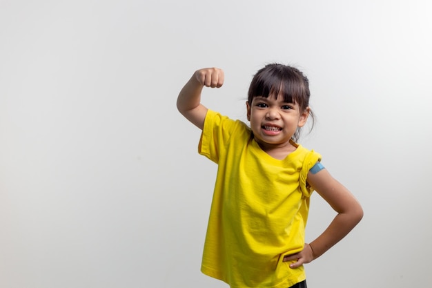 COVID 19 Vaccines for Kids concept Studio a portrait of an adorable Asian girl after getting his first dose of vaccine Immune Safe Available Back to school