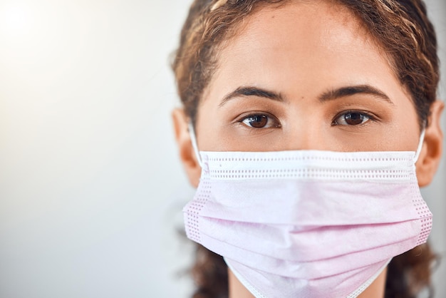 Covid face mask and woman in portrait for vision trust or hospital or clinic healthcare in studio mock up Young nurse Innovation compliance and safety with fear of risk for corona virus lens flare