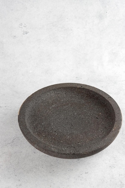 Cowek or cobek is Stone craft made from granite from Javanese Indonesia for mashing seasoning