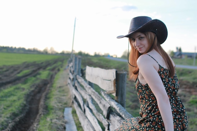 Cowgirl un hat with guitar