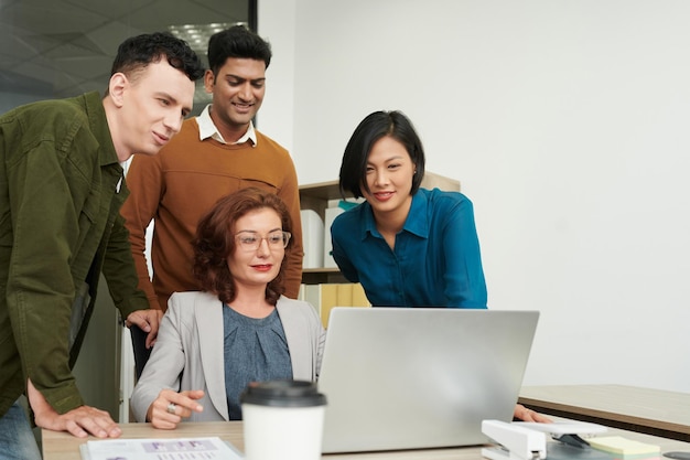 Coworkers Gathered to Watch Presentation