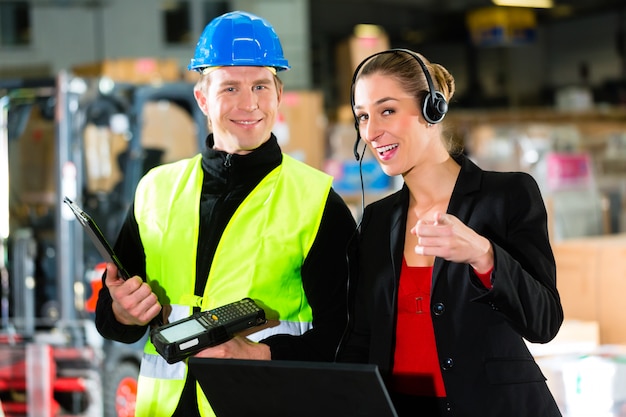 Coworkers at warehouse of forwarding company