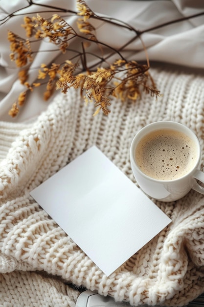 Photo cozy beige aesthetic coffee cup blank card and dried flowers on soft fabric