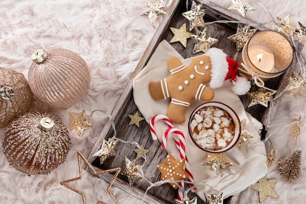 Cozy christmas composition with a cup and cookies. Hot chocolate with marshmallow.