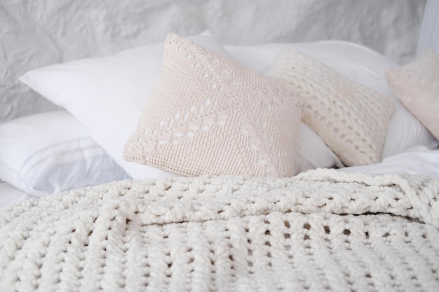 Cozy and fashion place for rest with pillow and knitted plaid