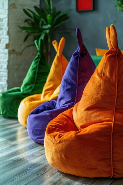 Photo cozy furniture arrangement featuring multiple bean bags on a wooden floor suitable for casual gatherings or indoor outdoor spaces