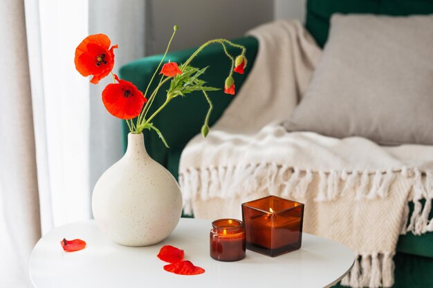 Cozy home interior with flowers and burning candles