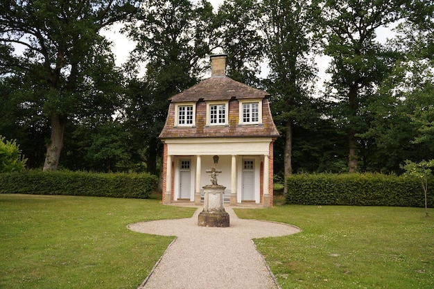 Cozy house with a fountain in the depths of the garden