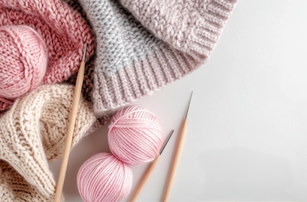 Cozy Knitting Setup With Pink Yarn and Blanket on a Light Surface