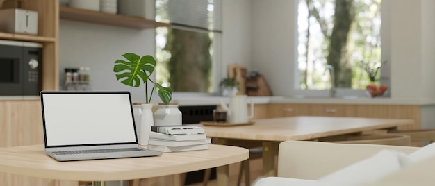 Cozy living room with laptop on the wooden table with books on the table