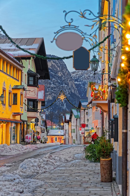 Cozy narrow street with Christmas illumination in Bavarian town of Garmisch-Partenkirchen, Germany