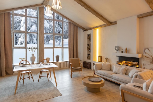 Cozy warm home interior of a chic country chalet with a huge panoramic window overlooking the winter forest open plan wood decoration warm colors and a family hearth