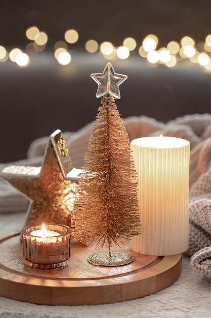 Cozy winter composition with decor details on blurred background with bokeh