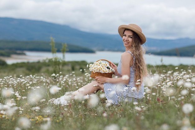 cozy woman in field of daisies