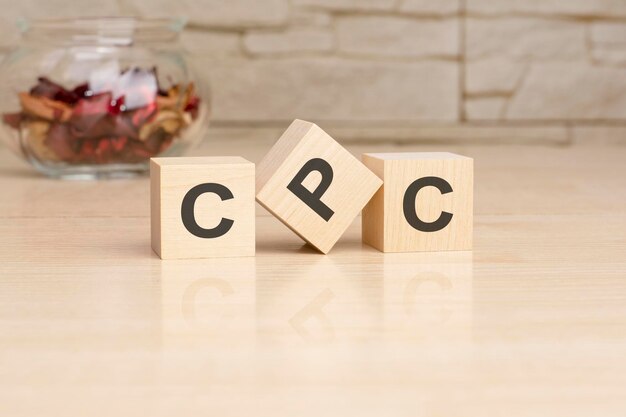 CPC acronym from wooden blocks with letters top view on grey background