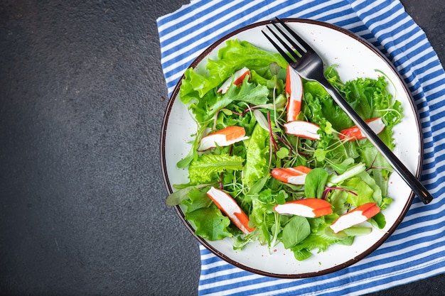 crab stick salad green lettuce leaves mix fresh meal snack on the table copy space food background