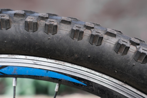 A cracked bicycle tire of a mountain bike Closeup Selective focus