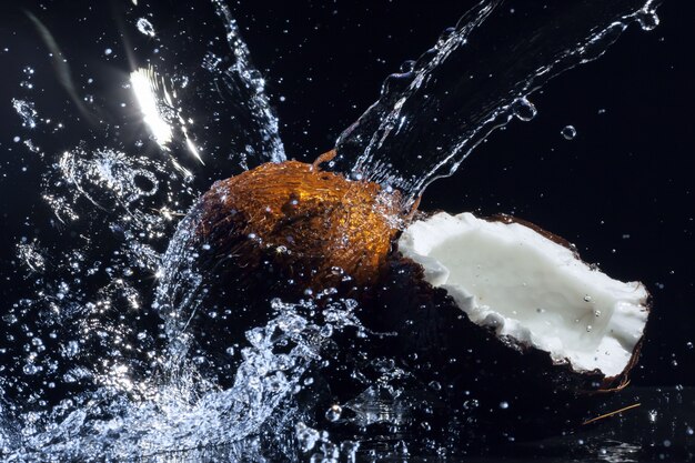 Cracked coconut splashing