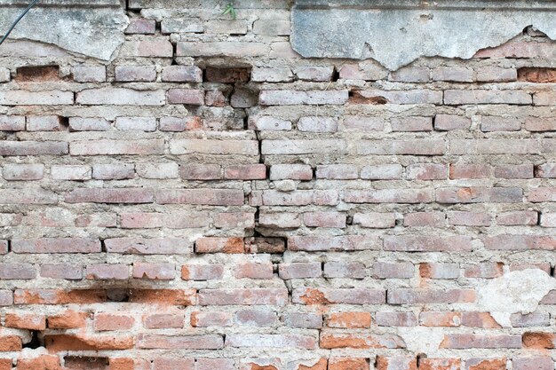 Cracked concrete vintage brick wall background