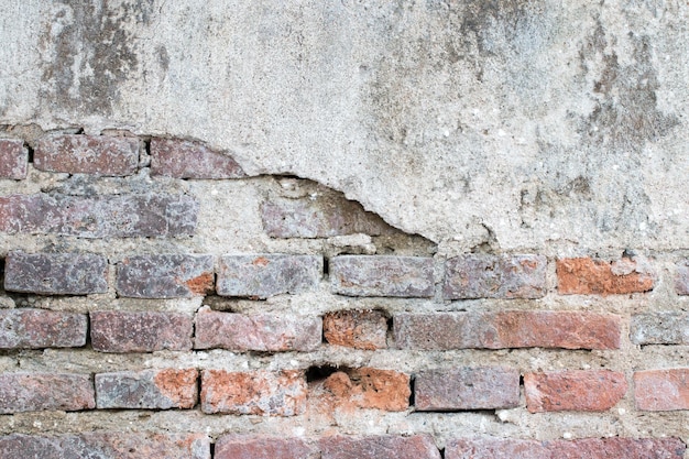 Cracked concrete vintage brick wall background