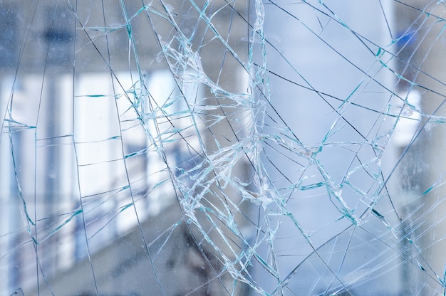 Cracked glass in a shop window background