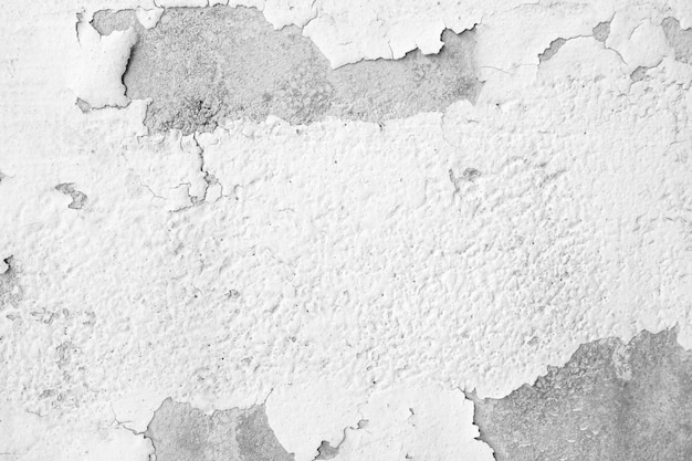 Cracked and peeling of white color paint on concrete wall texture and background