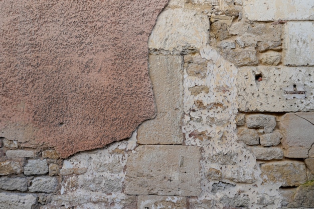 Cracked wall plastered brick real  aged architecture grunge stone half painted weathered copy-space