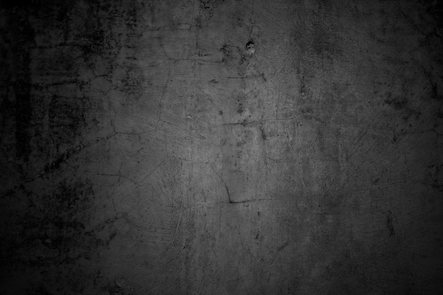 Cracked walls dark gray concrete concrete floor is aged in a retro concept Texture of a grungy black concrete wall as background