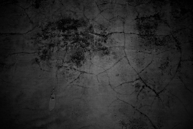 Cracked walls dark gray concrete concrete floor is aged in a retro concept Texture of a grungy black concrete wall as background