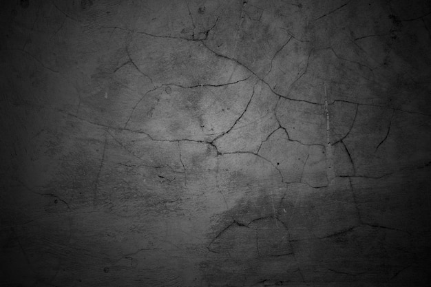 Cracked walls dark gray concrete concrete floor is aged in a retro concept Texture of a grungy black concrete wall as background