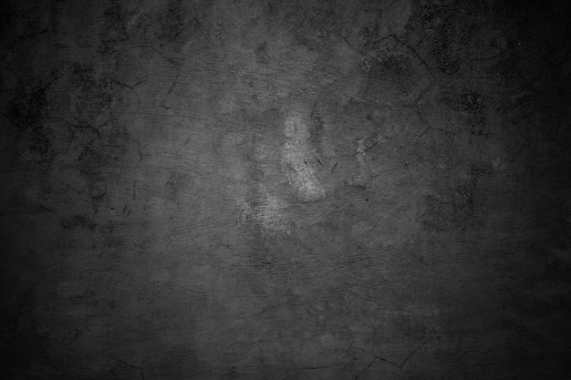 Cracked walls dark gray concrete concrete floor is aged in a retro concept Texture of a grungy black concrete wall as background