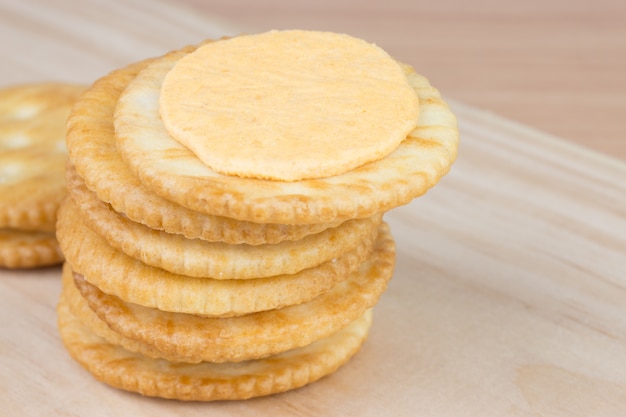 Cracker cream cheese on wooden table